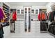 Spacious walk-in closet with custom shelving and ample storage space at 8760 Colonial Pl, Duluth, GA 30097