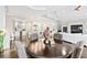 The dining room boasts a view into the gourmet kitchen with stainless steel appliances and a large kitchen island at 8760 Colonial Pl, Duluth, GA 30097