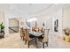 Elegant dining room with a modern chandelier, stylish chairs, and natural light at 8760 Colonial Pl, Duluth, GA 30097