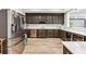 Modern kitchen with stainless steel appliances, dark cabinets, and light countertops at 8760 Colonial Pl, Duluth, GA 30097