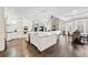 Spacious open-concept kitchen with large island, stainless steel appliances, breakfast area, and seamless flow into the living space at 8760 Colonial Pl, Duluth, GA 30097