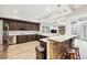 Gourmet kitchen with stone accent bar, stainless steel appliances, and lots of cabinets at 8760 Colonial Pl, Duluth, GA 30097