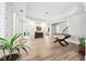 Bright living room with hardwood floors and a classic foosball table and decor at 8760 Colonial Pl, Duluth, GA 30097