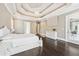 Bright main bedroom suite with trey ceiling, hardwood floors, and access to balcony at 8760 Colonial Pl, Duluth, GA 30097