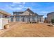 Large backyard with a large, enclosed porch and brick-paved patio, great for entertaining guests at 1109 Alaska St, Hampton, GA 30228