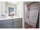 Cozy bathroom featuring a shower-tub combo with a neutral-toned vanity and modern fixtures at 1109 Alaska St, Hampton, GA 30228