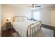 Comfortable bedroom featuring a brass bed frame, neutral colors, and lots of natural light at 1109 Alaska St, Hampton, GA 30228