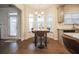 Cozy breakfast nook with a bay window, granite table and bright light at 1109 Alaska St, Hampton, GA 30228