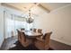 Elegant dining room featuring a large table, ornate chandelier and bright light at 1109 Alaska St, Hampton, GA 30228
