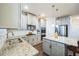 Modern kitchen featuring granite counters, stainless appliances and light grey cabinetry at 1109 Alaska St, Hampton, GA 30228