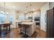 Modern kitchen with granite countertops, stainless steel appliances, and a center island at 1109 Alaska St, Hampton, GA 30228