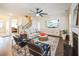 Inviting living room featuring an open floor plan, fireplace, and ample natural light at 1109 Alaska St, Hampton, GA 30228