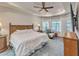 Bright main bedroom with a ceiling fan, and ample natural light from large windows at 1109 Alaska St, Hampton, GA 30228