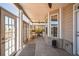 Relaxing sunroom with ample natural light, tile floors, and comfortable seating for any occasion at 1109 Alaska St, Hampton, GA 30228