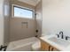 Full bathroom featuring a tub with tiled walls and modern vanity at 816 Berne St # 4, Atlanta, GA 30316