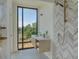 Modern bathroom featuring chevron pattern tiles, sleek fixtures, and a scenic view at 816 Berne St # 4, Atlanta, GA 30316