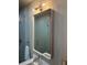 Stylish bathroom featuring a rectangular mirror, sleek light fixture, and glass-enclosed shower at 816 Berne St # 4, Atlanta, GA 30316