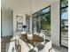 Sunlit dining room with designer lighting fixture and large windows with picturesque views at 816 Berne St # 4, Atlanta, GA 30316