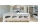 A well-lit kitchen island with seating and stainless appliances provides an open concept living space at 816 Berne St # 4, Atlanta, GA 30316