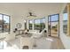A bright living room includes oversized windows, hardwood floors, recessed lighting and contemporary furniture at 816 Berne St # 4, Atlanta, GA 30316