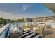 Relaxing rooftop patio with modern furniture and neighborhood view on a sunny day at 816 Berne St # 4, Atlanta, GA 30316