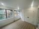 The bedroom features lots of natural light, wood-look floors, and a closet at 145 Amherst Nw Pl, Atlanta, GA 30327
