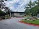 Exterior of 'Cross Creek Cafe' with lush landscaping, ramp, and well-maintained surroundings at 145 Amherst Nw Pl, Atlanta, GA 30327