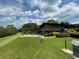 Stately multi-story home with stone foundation, a deck, and a perfectly manicured lawn at 145 Amherst Nw Pl, Atlanta, GA 30327