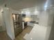 Modern kitchen featuring stainless steel appliances, white cabinets, and stone countertops at 145 Amherst Nw Pl, Atlanta, GA 30327