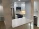 Renovated kitchen with stainless steel appliances and bright white cabinets at 145 Amherst Nw Pl, Atlanta, GA 30327