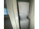 A stacked washer and dryer offer convenience and space-saving design in a laundry area at 145 Amherst Nw Pl, Atlanta, GA 30327
