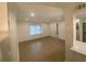Well-lit living room featuring stylish flooring and neutral décor at 145 Amherst Nw Pl, Atlanta, GA 30327