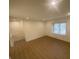 Cozy living room with updated flooring and natural light from the window at 145 Amherst Nw Pl, Atlanta, GA 30327