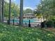A lovely, fenced pool area surrounded by mature trees and seating at 145 Amherst Nw Pl, Atlanta, GA 30327