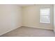 Spacious bedroom featuring neutral walls and a window with blinds at 326 Lauren Dr, Fairburn, GA 30213