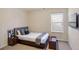 Cozy bedroom with modern furniture, including a bed, nightstands, and decorative accents, creating a relaxing space at 326 Lauren Dr, Fairburn, GA 30213