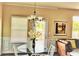 Cozy dining area with a glass table and a view of the outdoors at 326 Lauren Dr, Fairburn, GA 30213