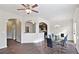 Elegant dining room featuring hardwood floors, an open floor plan, and a view into the kitchen at 326 Lauren Dr, Fairburn, GA 30213