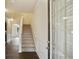Inviting foyer with staircase and natural light from the front door, leading to the home's living spaces at 326 Lauren Dr, Fairburn, GA 30213