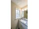 Bathroom featuring granite countertop vanity, modern fixtures, and a large mirror at 3865 Whitney Pl, Duluth, GA 30096