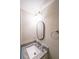 Cozy bathroom with stylish mirror, granite countertop, sink and modern fixtures at 3865 Whitney Pl, Duluth, GA 30096