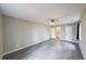 Spacious bedroom with wood-look flooring, ceiling fan, and ensuite bathroom at 3865 Whitney Pl, Duluth, GA 30096