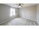 Bedroom with neutral carpet and a ceiling fan at 3865 Whitney Pl, Duluth, GA 30096