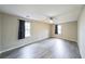 Spacious bedroom featuring modern ceiling fan, neutral paint and sleek flooring at 3865 Whitney Pl, Duluth, GA 30096