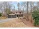 Charming two-story home featuring a two-car garage and a cozy front porch nestled on a hillside at 3865 Whitney Pl, Duluth, GA 30096