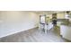 Bright, spacious kitchen featuring white cabinets, granite countertops, an island and modern stainless steel appliances at 3865 Whitney Pl, Duluth, GA 30096