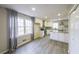 Bright kitchen featuring white cabinets, granite countertops, an island and modern stainless steel appliances at 3865 Whitney Pl, Duluth, GA 30096