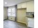 Bright kitchen featuring white cabinets, granite countertops and modern stainless steel appliances at 3865 Whitney Pl, Duluth, GA 30096