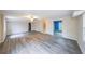 Spacious living room features gray floors, a ceiling fan and ample natural light at 3865 Whitney Pl, Duluth, GA 30096