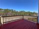 Enjoy the outdoors on this spacious back deck with a beautiful view of the surrounding trees at 5546 Wellborn Creek Dr, Lithonia, GA 30058
